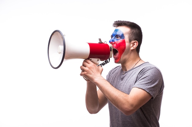 Young czech football fan with megaphone isolated on white wall