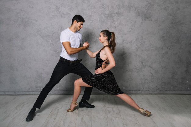 Young dance partners dancing tango