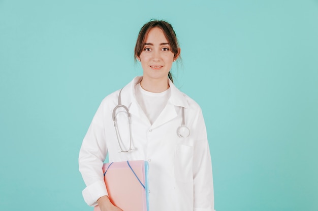 Free photo young doctor with stethoscope and documents