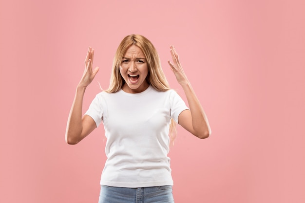 Free Photo the young emotional angry woman screaming on studio