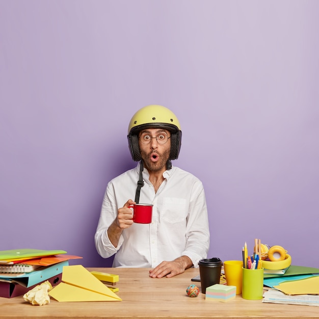 Free Photo young employee sitting at the office desk