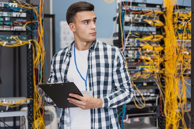 Free Photo young engineer in server room