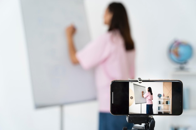 Young english teacher doing her lessons online