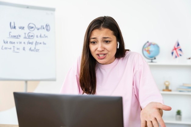 Young english teacher doing her lessons online