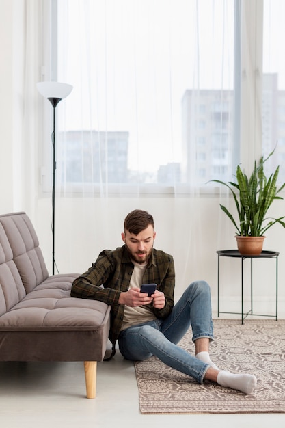 Young entrepreneur browsing mobile phone