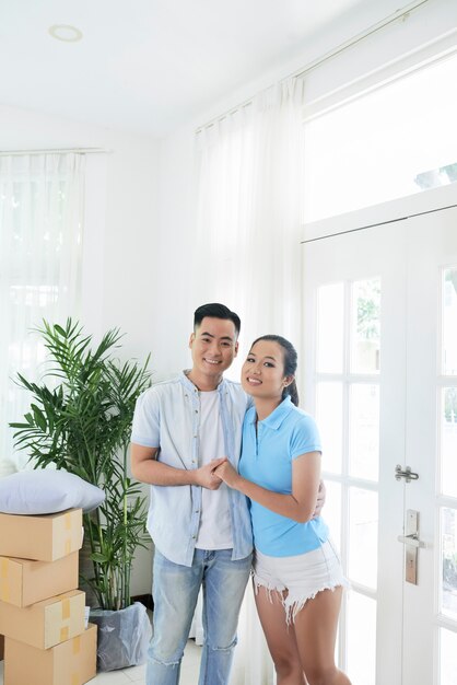 Young ethnic couple in new real estate