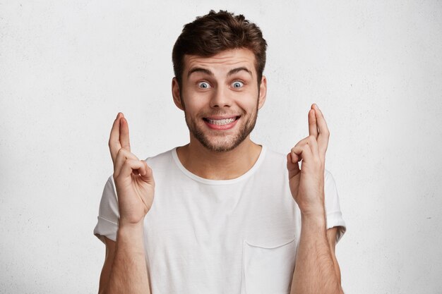 Young expressive man with white T-shirt