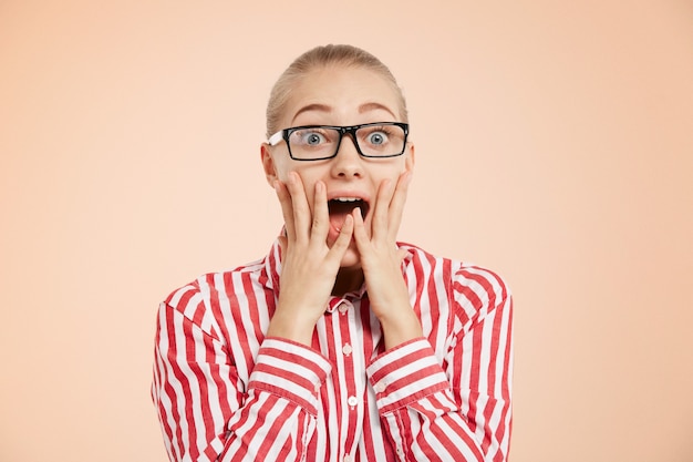 Young expressive woman in striped shirt