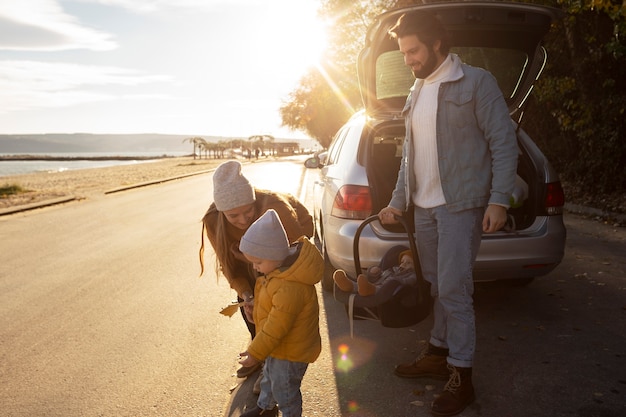 Free photo young family enjoying their trip