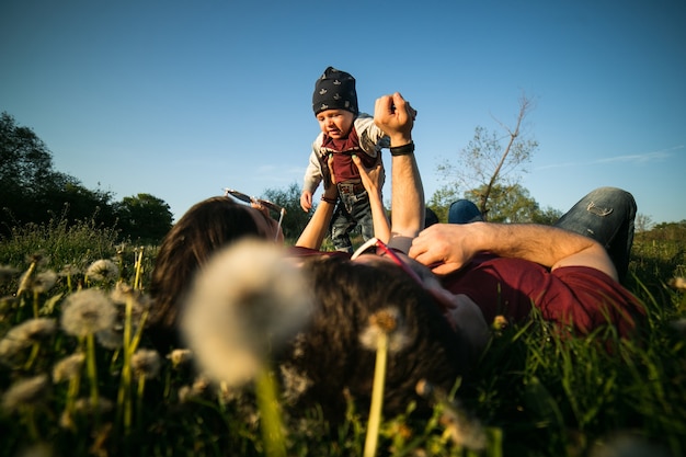 Young family have fun and relaxing outdoors in the countryside