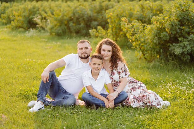 Young family looking while walking in the garden