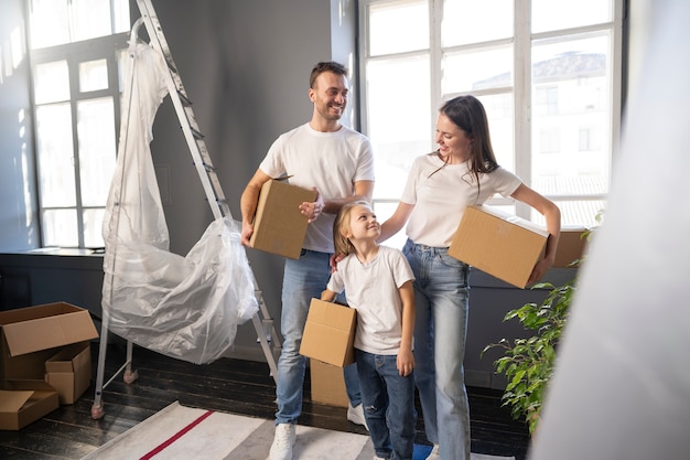 Free photo young family moving into a new home