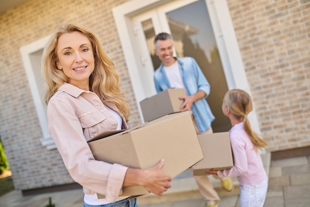 Free photo young family moving to a new house