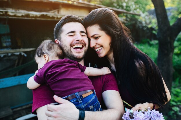 Young family on the nature in the countryside