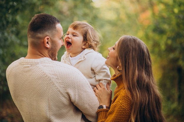 Free photo young family with children in autumn park