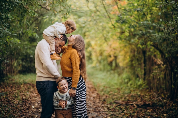 Free photo young family with children in autumn park