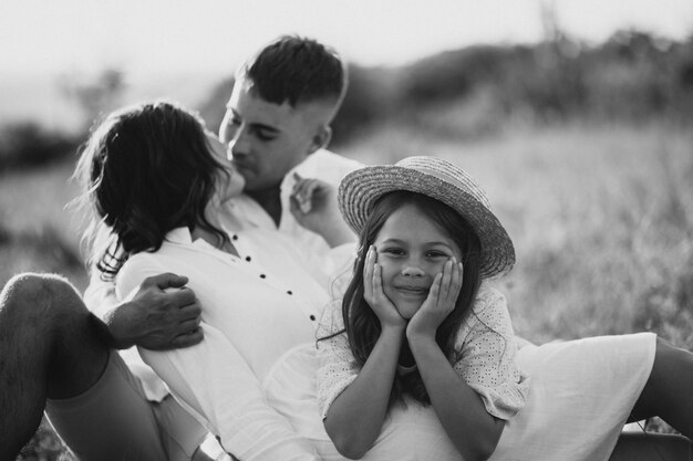 Young family with daughter in meadow