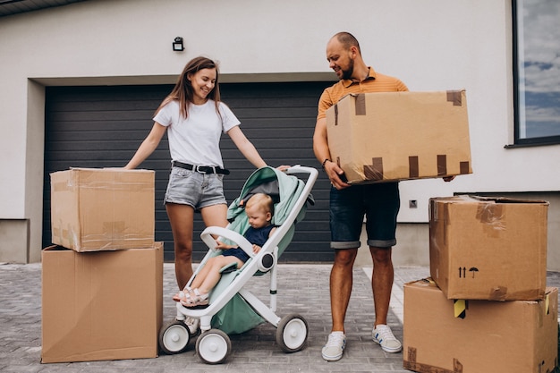 Young family with little daughter moving into new house