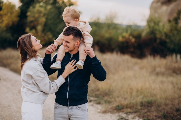 Young family with little son in park