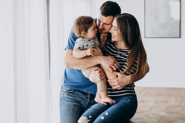 Young family with their little son at home