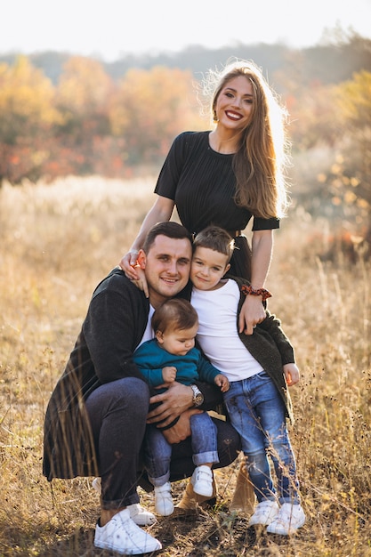 Young family with two sons together in park