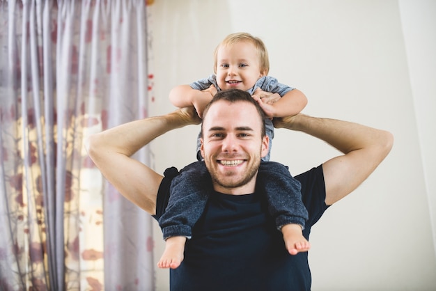 Young father playing with his son