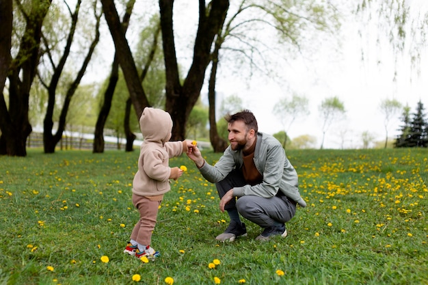 Young father with his baby outdoors