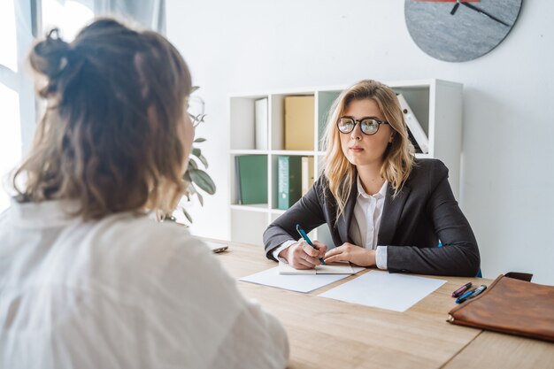 Young female candidate interviewed by employer