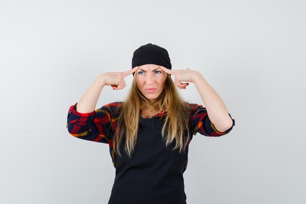 Free photo young female cook in a black apron