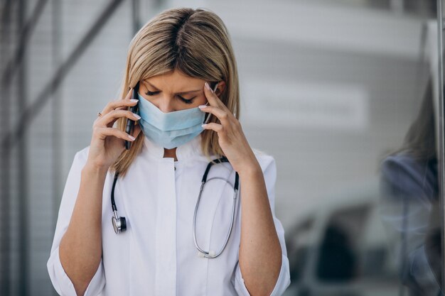 Young female doctor in hospital ambulance