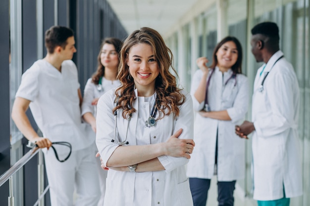 Free Photo young female doctor posing in the corridor of the hospital