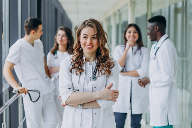 Free photo young female doctor posing in the corridor of the hospital