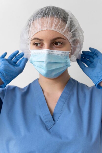 Young female doctor wearing a protective equipment