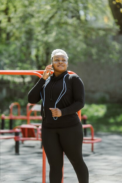 Young female having fun training outdoor