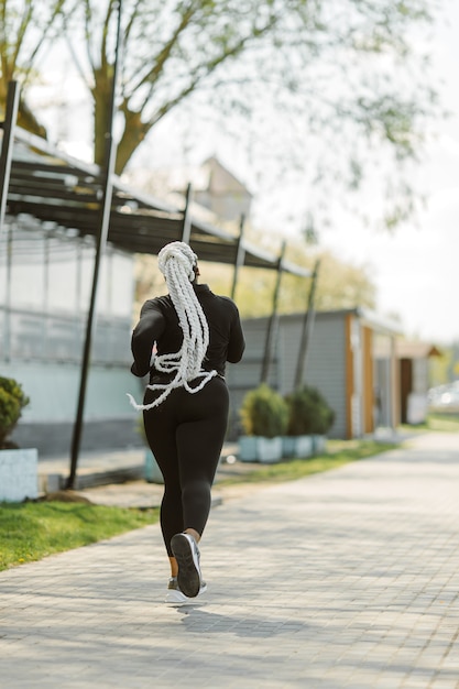 Young female having fun training outdoor