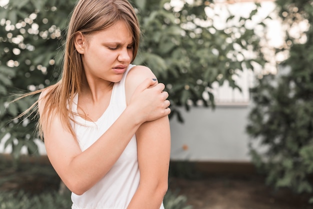 Free Photo young female having shoulder pain