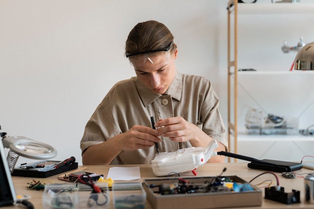 Young female inventor in her workshop