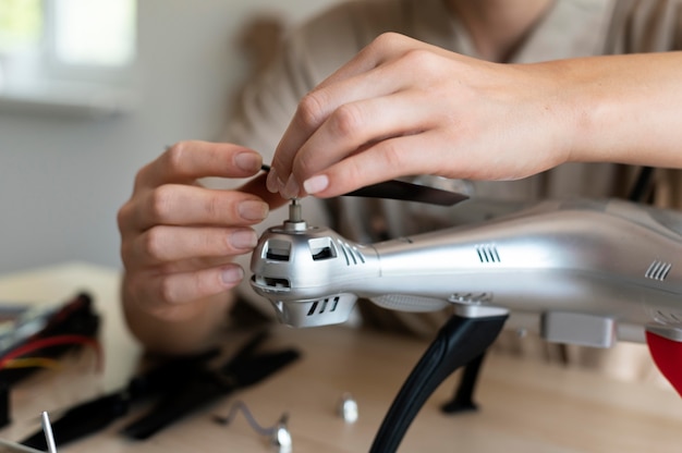 Free Photo young female inventor in her workshop