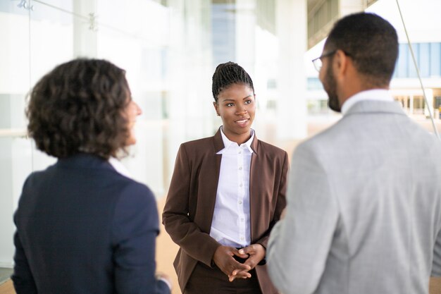 Young female manager meeting partners