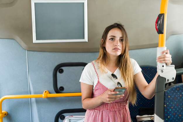 Young female model in the bus