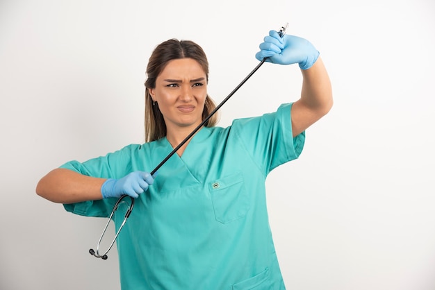 Young female nurse posing with stethoscope.