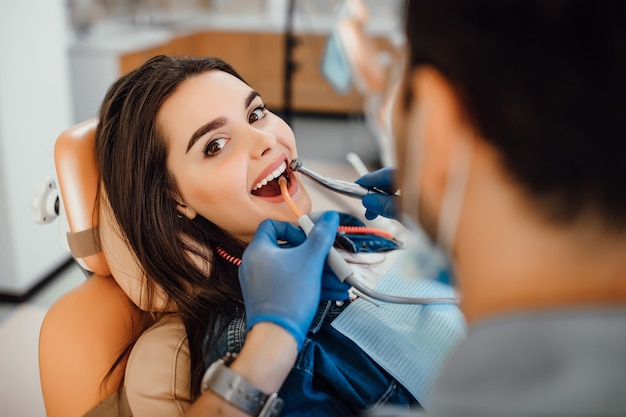 Young female patient visiting dentist office.