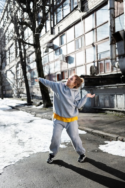 Free photo young female performer dancing in an abandoned building