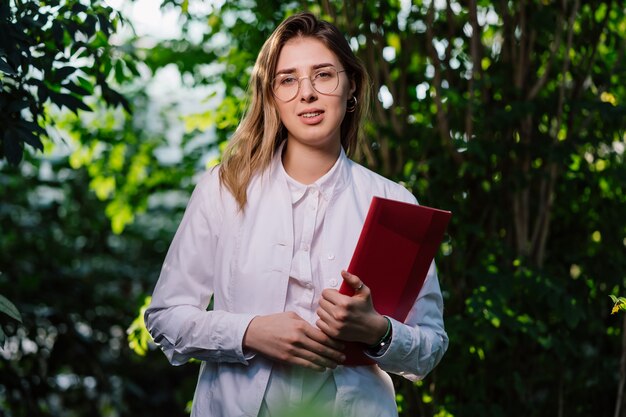 Young female scientist in the forest