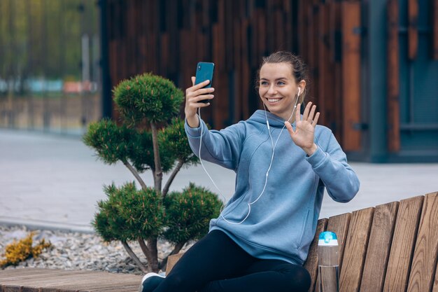 Young female taking selfie from above in park