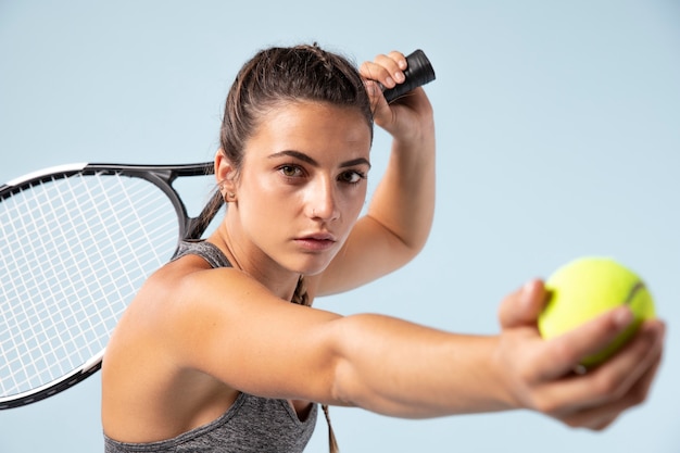 Free photo young female tennis player with racket