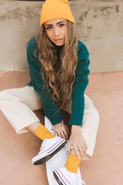 Free photo young female with skateboard