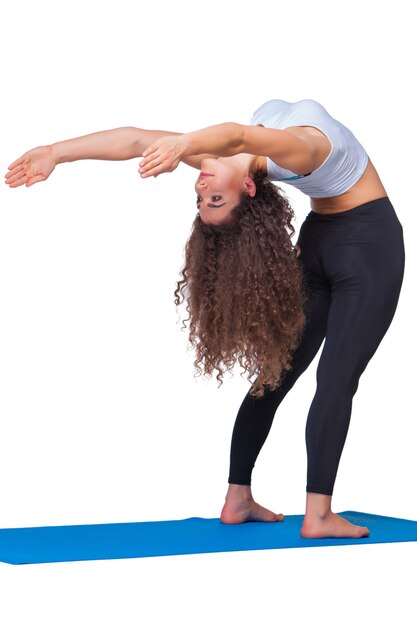 Free photo young fit woman doing yoga exercises.