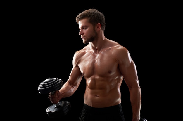 Young fitness man in studio