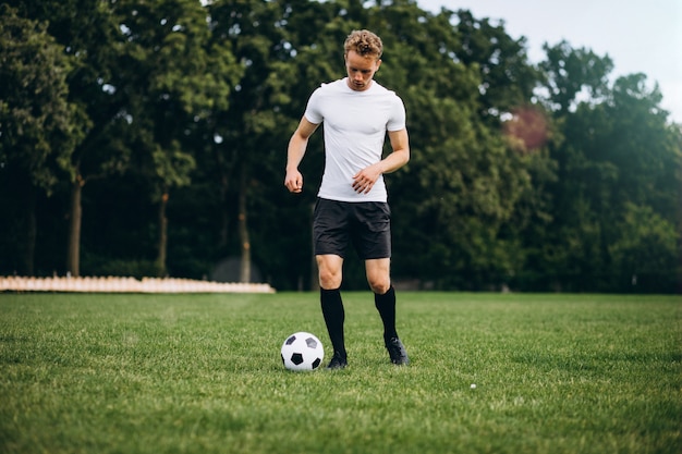 Young football player at the football field